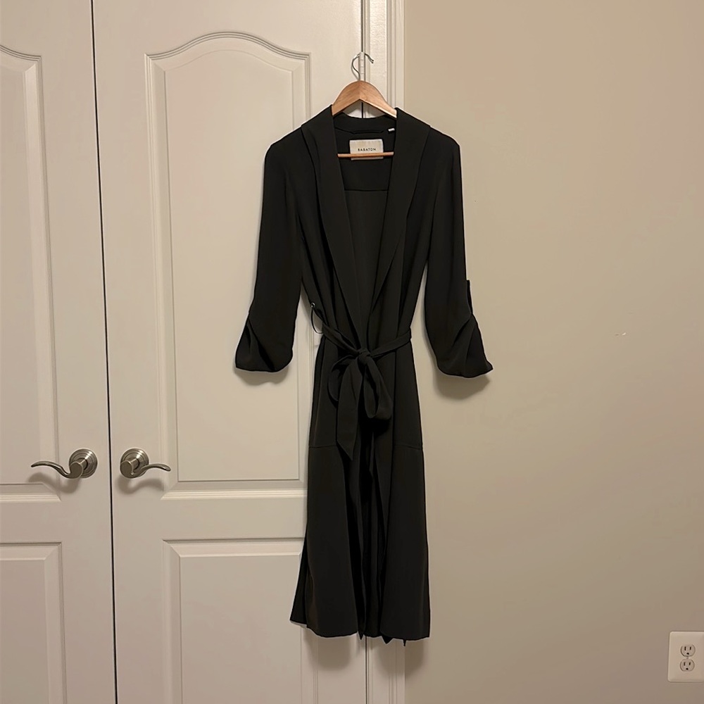 Deep green colored trench coat